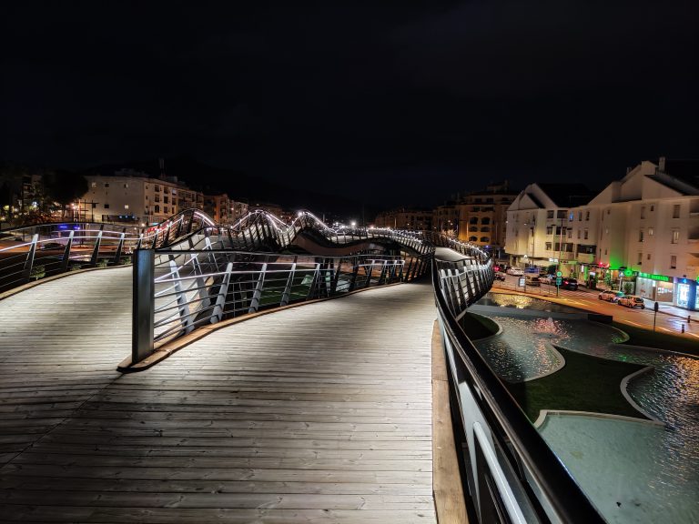 'The lit pedestrian boulevard above the buried A-7 in San Pedro Alcántara at night'